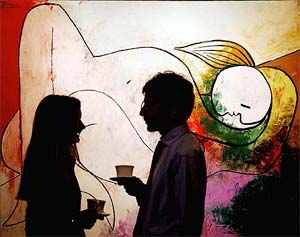 Two viewers of Sothebys summer sale of Impressionist band Modern Art have tea while talking in front of Pablo Picassos Femme couchee a la meche blonde