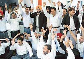 Members of the District Bar Association, Chandigarh, protest in front of the Sector 17 police post against detention and booking of an advocate in a criminal case on Thursday.
