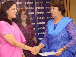 Ms Namita Gautam, President, FICCI Ladies Organisation, and Begam Salma Ahmed, President, Womens Chamber of Commerce & Industry, Pakistan, sign an MoU
