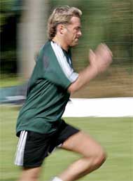 Norwegian referee Anders Frisk runs during a training session for Euro 2004