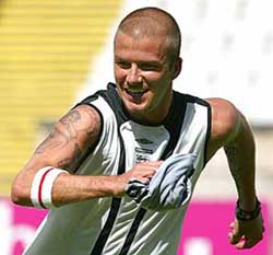 Englands captain David Beckham sprints during a practice session at the National Stadium in Lisbon