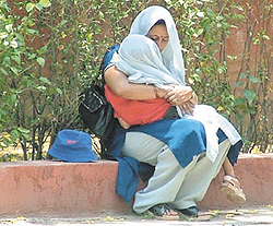 Neelam, wife of Delhi Police ASI, with her son sitting on dharna outside the residence of Delhi High Court Chief Justice B. C. Patel in the Capital on Sunday. 