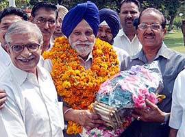 Deputy Speaker of Lok Sabha Charanjit Singh Atwal being greeted by BJP workers in Amritsar on Sunday.