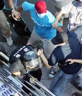 Protesters scuffle with the police during an anti-war and anti-World Economic Forum rally on Seoul on Sunday. 