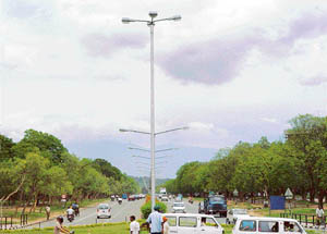 Clouds of delight: As clouds bring down the temperature in the city, residents enjoy a pleasant breeze while driving on Monday.