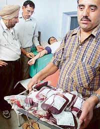 Blood bags being taken away after a blood donation camp at the General Hospital, Sector 16, Chandigarh, on Monday. 