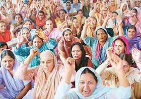 Members of the Pind Bachao Action Committee and Gram Panchayat, Kishangarh village, hold a protest rally