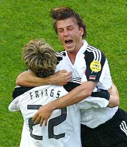 Germany's Torsten Frings celebrates with team-mate Bernd Schneider after scoring a goal during their Euro 2004 Group D soccer match