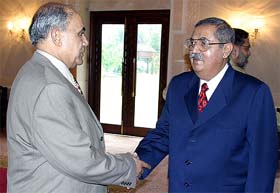 Pakistan's Secretary of the Ministry of Narcotics Control Khalid Latif greets India's Director-General of Narcotics Control M.K. Singh in Islamabad