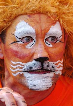 A Dutch supporter has his face painted like a tiger