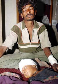 Three-year-old Ratan and his father Jagdesh from Rajasthan receiving treatment