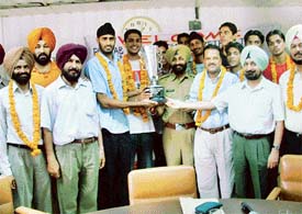 Mr Rajdeep Singh Gill, President, Basketball Federation of India, with the Punjab basketball team which won Junior National Basketball Championship in Chittor, Andhra Pradesh, being felicitated at a function in Ludhiana