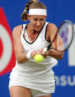 Mary Pierce of France returns with a backhand to Anne Kremer of Luxembourg