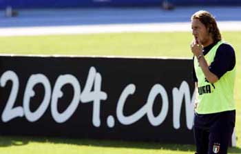 Italy's striker Francesco Totti walks on the pitch during a training session