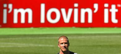 Englands David Beckham warms up during a practice session