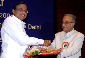 Union Finance Minister P. Chidambaram (left) being presented a bouquet by West Bengal Finance Minister Asim Dasgupta during a meeting on VAT in New Delhi