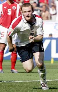 England's Wayne Rooney celebrates his goal against Switzerland during the group B match