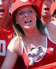 A Swiss soccer fan cheers before the start of the group B first round match