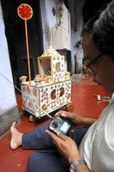 Barij Kumar Paul, an Indian amateur radio-wave toy maker, checks a rath
