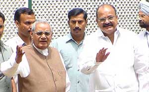 Former Prime Minister Atal Bihari Vajpayee and BJP President Venkaiah Naidu pose for photographers before the BJP Parliamentary Board meeting in New Delhi on Sunday. 