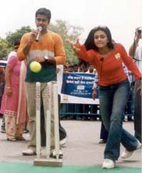 Film actress Mandira Bedi bowls to a participant during the Gully Cricket show organised by the Set Max channel 