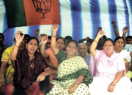 Activists of the BJP Mahila Morcha sitting on a dharna against the BSES on the issue of power tariff hike at Nizamuddin in the Capital on Monday