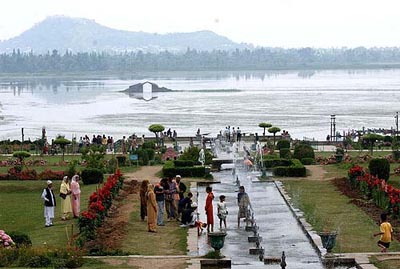 Tourists enjoy themselves at Nishat Bagh in Srinagar