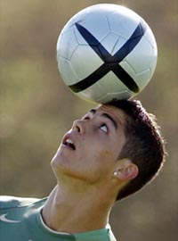 Portugal's Cristiano Ronaldo heads a ball during his training session in Alcochete on Tuesday