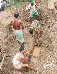 Work in progress to repair the water pipeline which burst in Sector 47