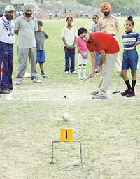 Coach Satwant Singh guides trainees in gate ball at the Panjab University ground in Chandigarh