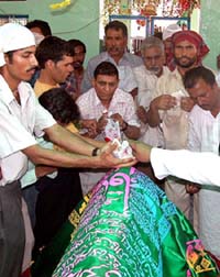 Indian pilgrims pay obeisance at the dargah of Baba Chamliyal near the Indo-Pakistan border