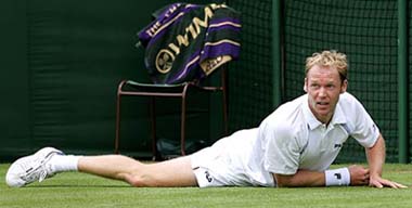 Eighth seed Rainer Schuettler of Germany lies on the court during his match against Robin Soderling of Sweden at Wimbledon on Thursday. Schuettler won 4-6, 6-3, 7-6, 1-6, 6-2. 