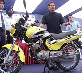 TVS Motors brand ambassador Sachin Tendulakar with TVS 125cc GLX bike, as a part of TVS Motors promotional campaign, Hungama, at a TVS showroom in New Delhi on Friday. 
