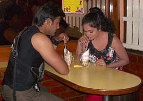 Gracy Singh and Arya Babbar enjoy cold coffee as part of their scene which was shot at Hot Millions-2 in Sector 17, Chandigarh