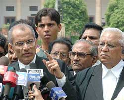 Colin Gonsalves, advocate for Dhananjay, along with T.C. Sharma, advocate, West Bengal Government, address mediapersons after the hearing at the Supreme Court in New Delhi on Friday. 