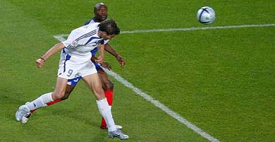 France's William Gallas watches as Greece's Angelos Haristeas scores the winner 
