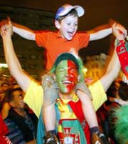 Fans celebrate Portugal's quarterfinal victory over England in Porto on Thursday