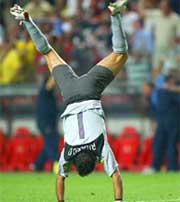 Portugal's goalkeeper Ricardo celebrates after Helder Postiga scored the equalizer 