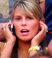Colleen McLoughlin, girlfriend of English striker Wayne Rooney, waits for the start of the quarterfinal match between England and Portugal in Lisbon
