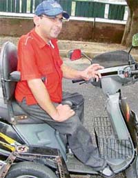 Anuj Tandon shows off the vehicle which he can drive