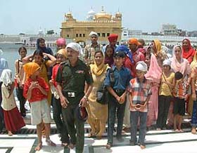 Families of Army personnel deployed in border areas at the Golden Temple in Amritsar