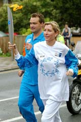British landmine campaigner Heather Mills-McCartney, the wife of Sir Paul McCartney, carries the Olympic torch