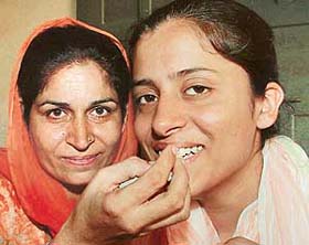Ravneet Kaur of Vikram Public High School with her mother after topping Ropar district in the Punjab School Education Board, Class X examination