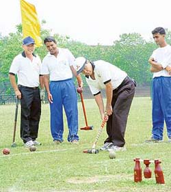 Pheekianseng of Singapore attempting a shot during the invitational International Woodball Championship