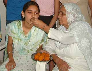 Anupreet Kaur, who got the second position in the matriculation examination of the Punjab School Education Board, with her grandmother