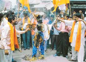 Shiv Sena activists burn an effigy of 
