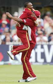 Dwayne Bravo of the West Indies celebrates with teammate Dwayne Smith 