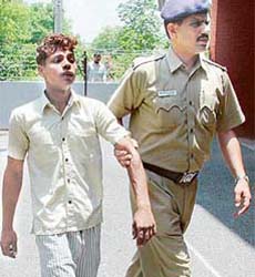 The alleged rapist, Ashraf, in police custody in Chandigarh