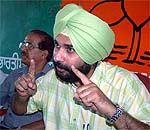 Cricketer-turned-MP Navjot Singh Sidhu speaks to mediapersons in Amritsar 