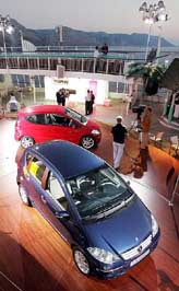Two Mercedes A-Class cars stand on the upper deck after its launch 